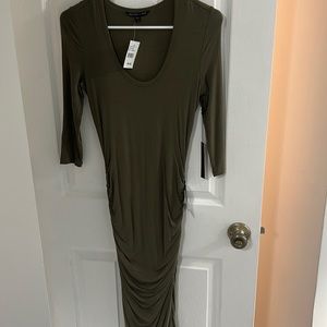 Long green dress, gathered detail on side.